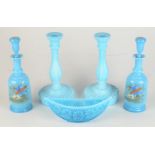 A pair of blue glass perfume bottles and stoppers, painted with birds and foliage, height 23cm,