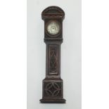 An oak miniature longcase clock with a 17th century silver dial by Hewitt London and with a