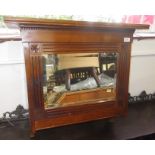 An Edwardian walnut wall cabinet with a rectangular mirrored door, height 64cm, width 70cm,