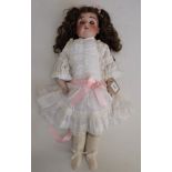 A good quality porcelain shoulder plate head doll, the head with sleep eyes, open mouth,