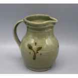 A Ray Finch Winchcombe Pottery jug, the green glaze decorated with brown abstract decoration,