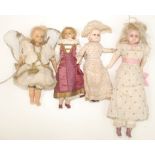 Four shoulder plate wax head dolls each with inset eyes, longest is 17".