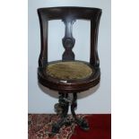 A late 19th century walnut ship's swivel dining chair,