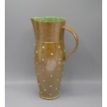 A large Alistair Young stoneware jug, with a brown mottled glaze and green glazed interior,