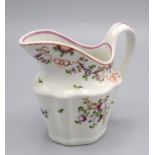 A Newhall porcelain helmet shape cream jug, circa 1790, painted with floral sprays,