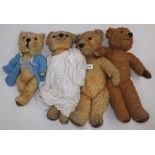 Four small gold plush teddy bears, love worn, the larger length 16".