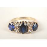 A 9ct gold blue and white stone ring in Victorian style.