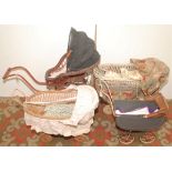 Two small wicker dolls prams together with a 1920s style small doll's pram and a Victorian style