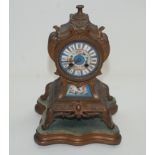 A French gilt metal mantel clock, 19th century, the floral painted 9.