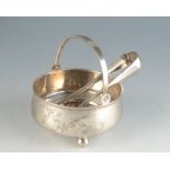 A Russian silver bowl with swing handle on three ball feet, maximum diameter 10.