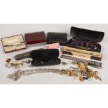 A gold mounted cigarette holder, various cuff links etc.