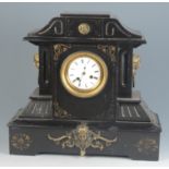 A large Victorian black slate mantel clock,