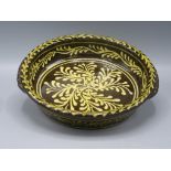 A Paul Young slipware pottery circular shallow bowl,