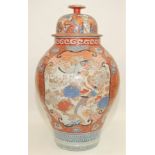 A large Japanese Arita porcelain vase and cover, with panels enclosing birds, cranes,