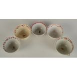Five Newhall porcelain tea bowls, circa 1800, each decorated with floral sprays.