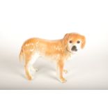 A Staffordshire pottery figure of a dog, length 35cm.