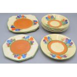 Eleven Clarice Cliff crocus pattern plates and saucers, largest 22cm.