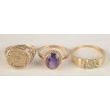 Two 9ct gold rings and a 9ct gold ring set with amethyst.