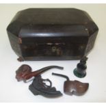 A black japanned work box, 19th century, with two pipes, etc.