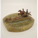 A green onyx ashtray, with a cold painted hunting scene mount, width 14.5cm.