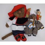 A soft plush cat dressed as a cavalier,