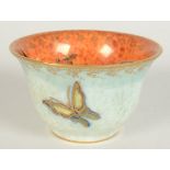 A Wedgwood fairyland lustre tea bowl, the mottled orange interior decorated with insects,