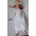 A porcelain head doll by Heubach Koppelsdorf, the porcelain head with sleep eyes,