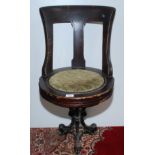 A late 19th century walnut ship's swivel dining chair,