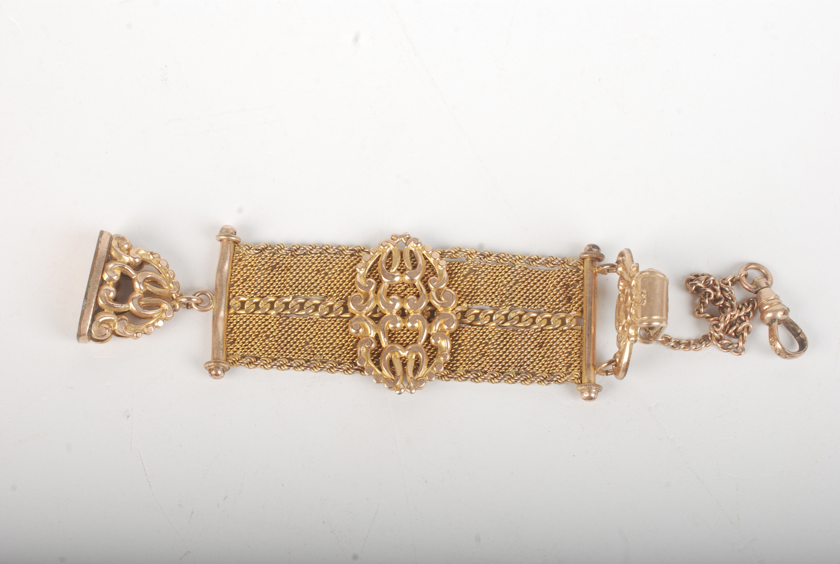 A gilt seal and strap.