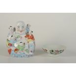 A Chinese porcelain Buddha seated smiling, 20th century, with five playful children, height 21cm,