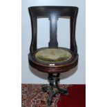 A late 19th century walnut ship's swivel dining chair,