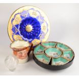A large Bohemian blue and gilt decorated charger, diameter 40cm and a Doulton character jug,
