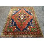 A large Heriz design carpet,