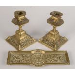 A pair of Aesthetic Movement brass candlesticks, each with Victorian diamond date impressed mark,