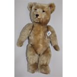 A brown plush Kapok and wood wool stuffed teddy bear, felt paws, stitched toes and nose,