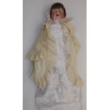 A porcelain head doll by Ernst Heubach, the porcelain head with sleep eyes,