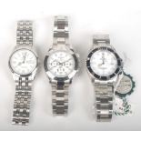 Three modern gents stainless steel wrist watches, each with automatic movement.