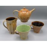 An Alistair Young brown stoneware teapot, height 14cm, a jug with a lobed body,