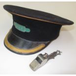 A railway black felt cap with green enamelled badge inscribed 'Guard' and a BR (W) whistle.