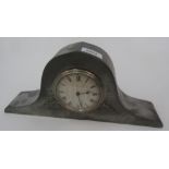An Arts and Crafts hammered pewter mantel clock, the 8.5cm silvered dial inscribed 'E.C.