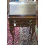 A George II style walnut bureau,