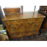 A continental figured walnut veneered 19th century chest of four long drawers above a plinth on