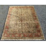 An Indian carpet, the cream field with a small central medallion,