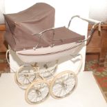 An early 1970s Oberon pram in mint and sable colours, produced between 1970 and 1973,