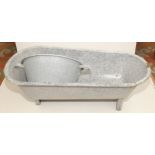 A tin plate bath with granite type enamelling and a circular bowl with splatter enamel,