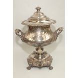 A handsome George IV Sheffield plated tea urn, with floral decorated handles and body,