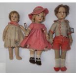 Two firmly filled felt dolls, each with moulded face and painted features,