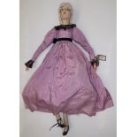 A 1920s or early 30s boudoir doll with composition shoulder plate head,