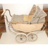 A 1940s or 1950s Silver Cross coach built pram, worn, full height 32".