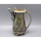 A Ruthanne Tudball green glazed stoneware water jug, height 16cm.